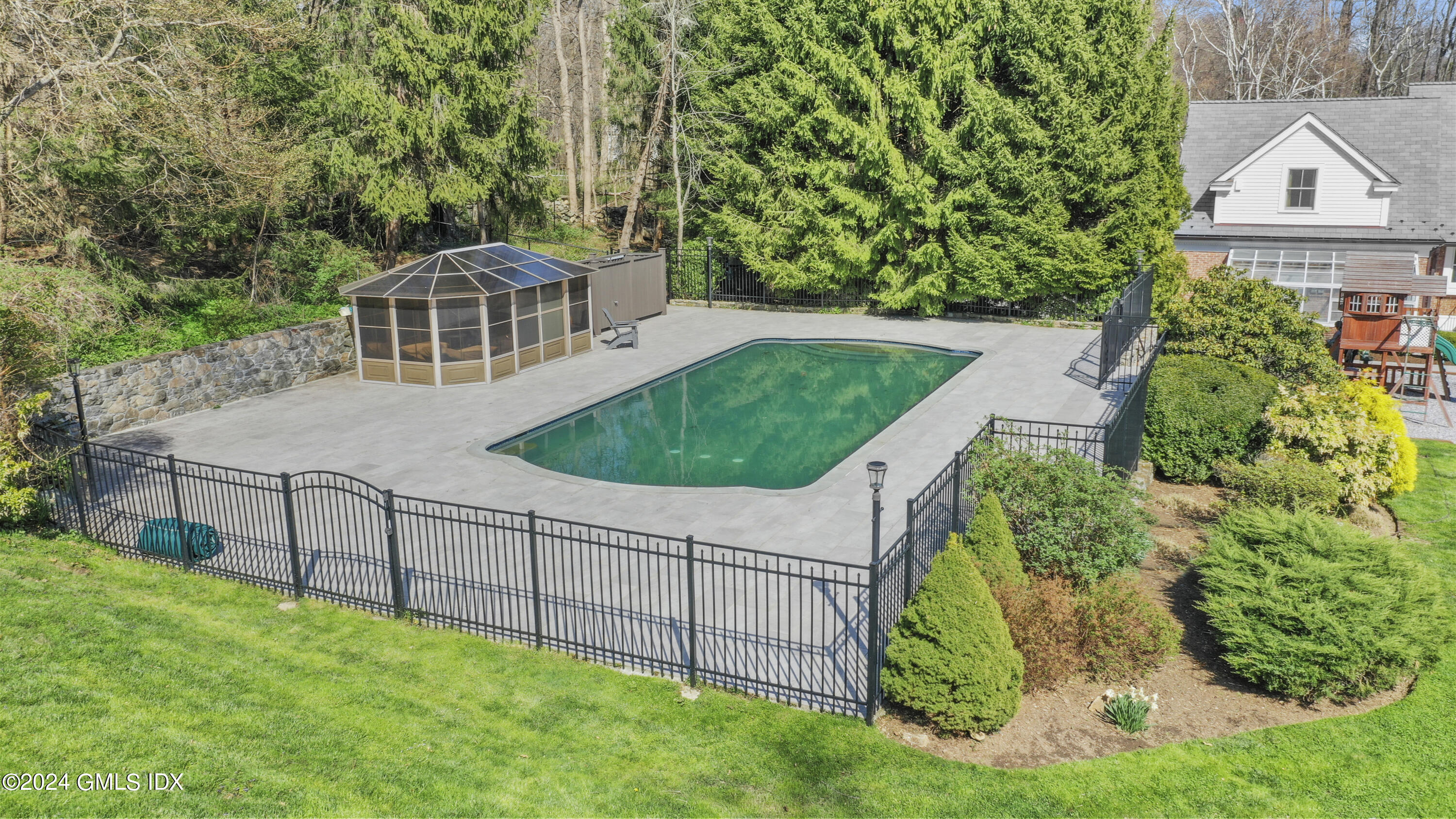 24 Highland Farm Road Greenwich, CT 06831 - Photo 2 of 34 a view of a house with a backyard