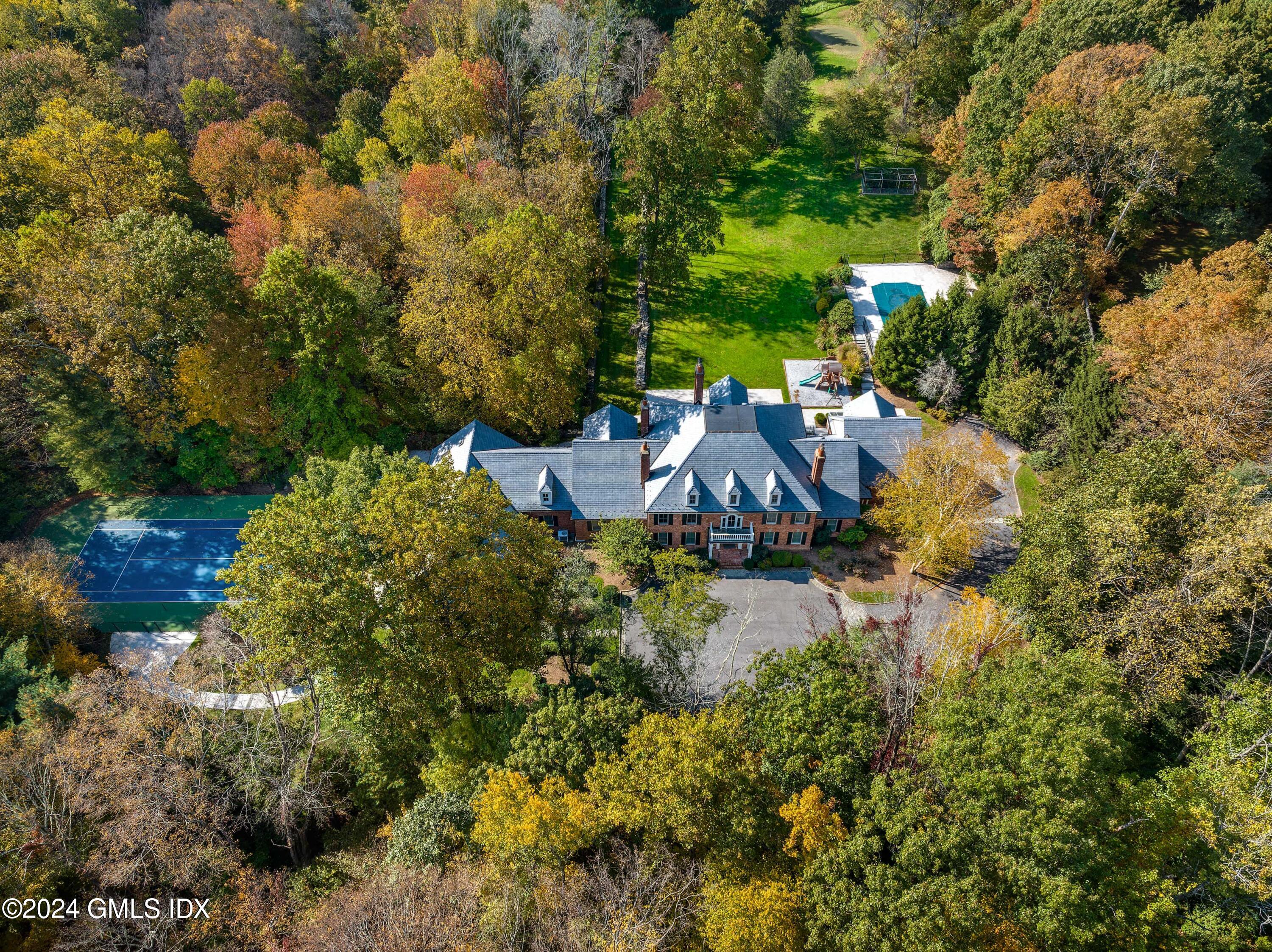 24 Highland Farm Road Greenwich, CT 06831 - Photo 28 of 34 a view of a house with a yard