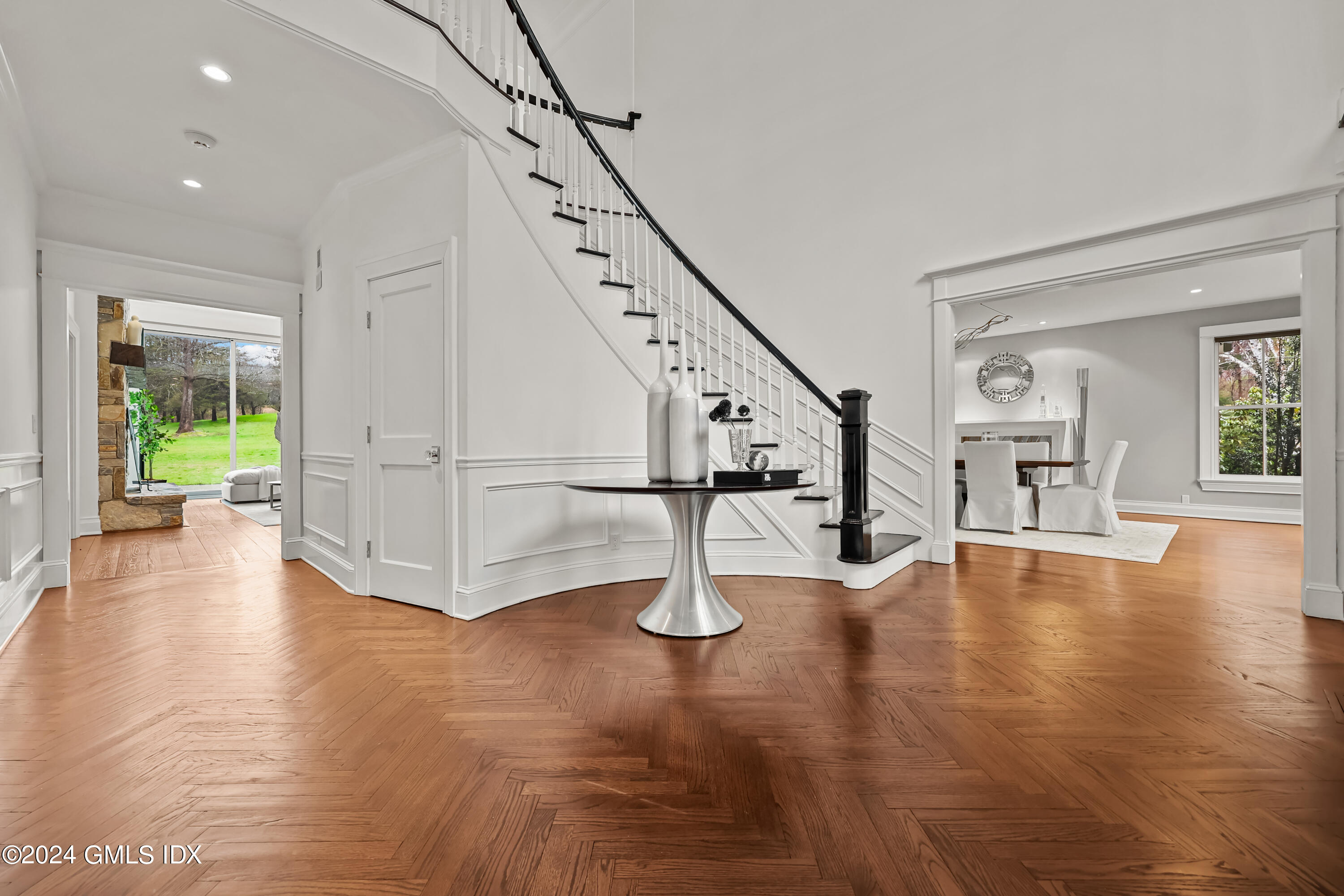 24 Highland Farm Road Greenwich, CT 06831 - Photo 6 of 34 a view of an entryway with wooden floor and windows