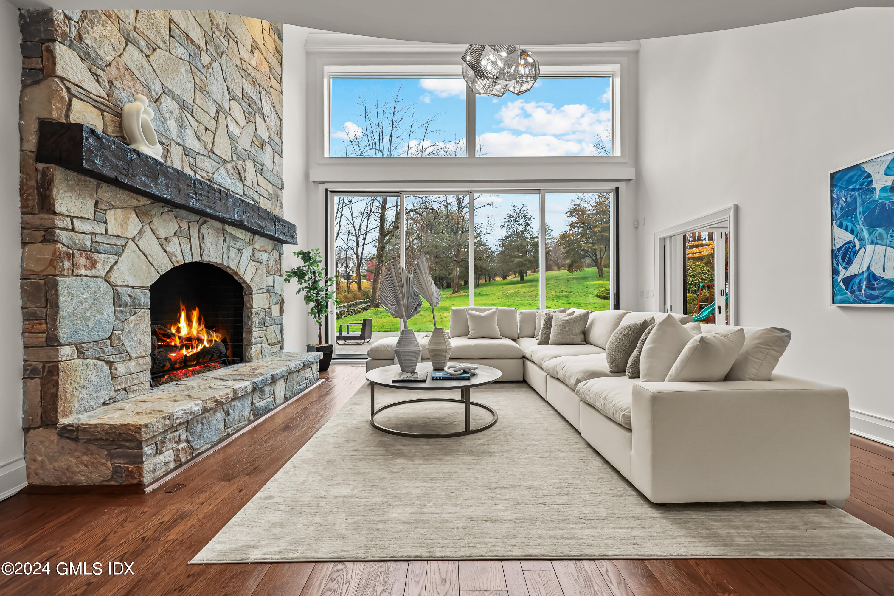 24 Highland Farm Road Greenwich, CT 06831 - Photo 7 of 34 a living room with furniture and a fireplace