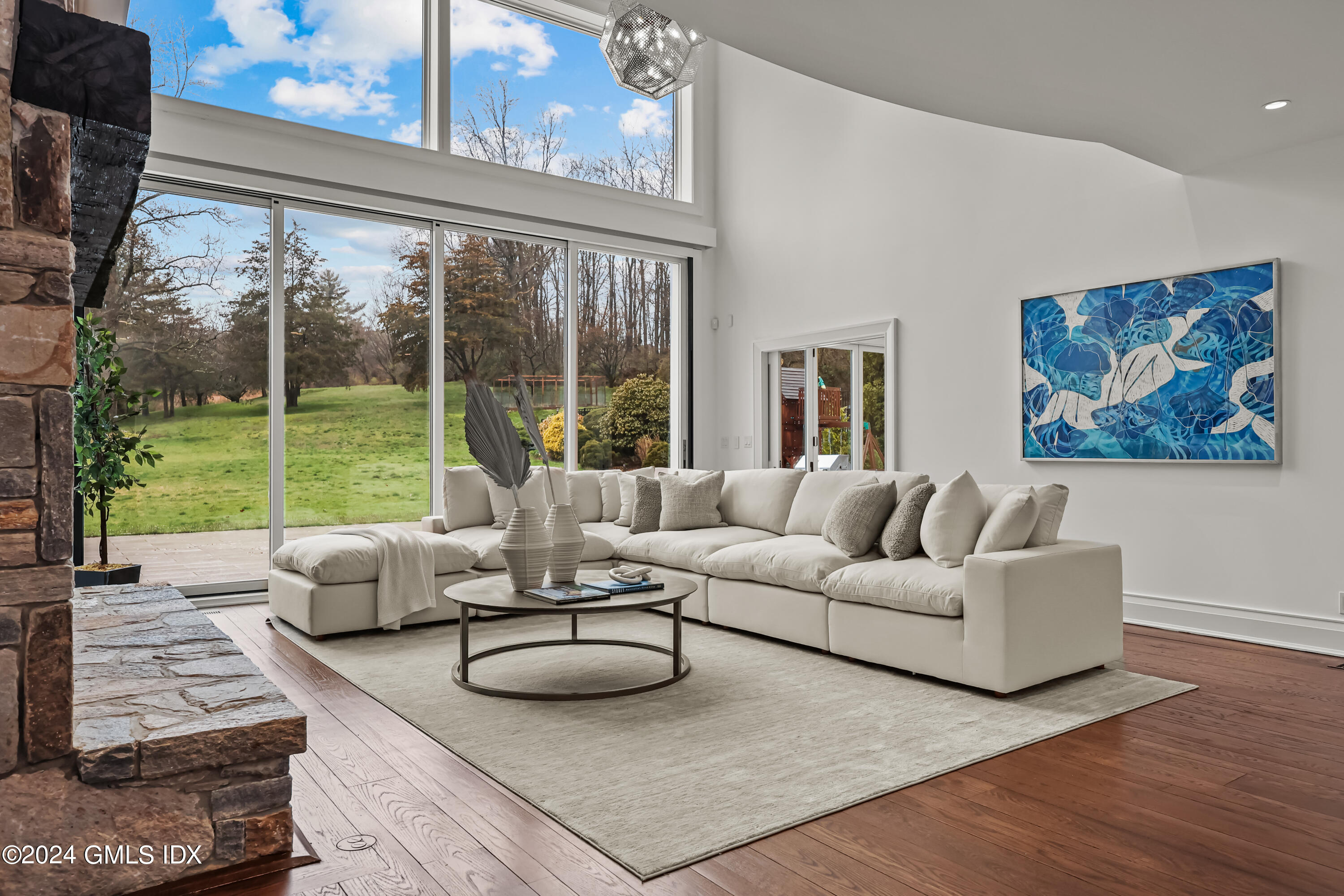 24 Highland Farm Road Greenwich, CT 06831 - Photo 8 of 34 a living room with furniture and a large window