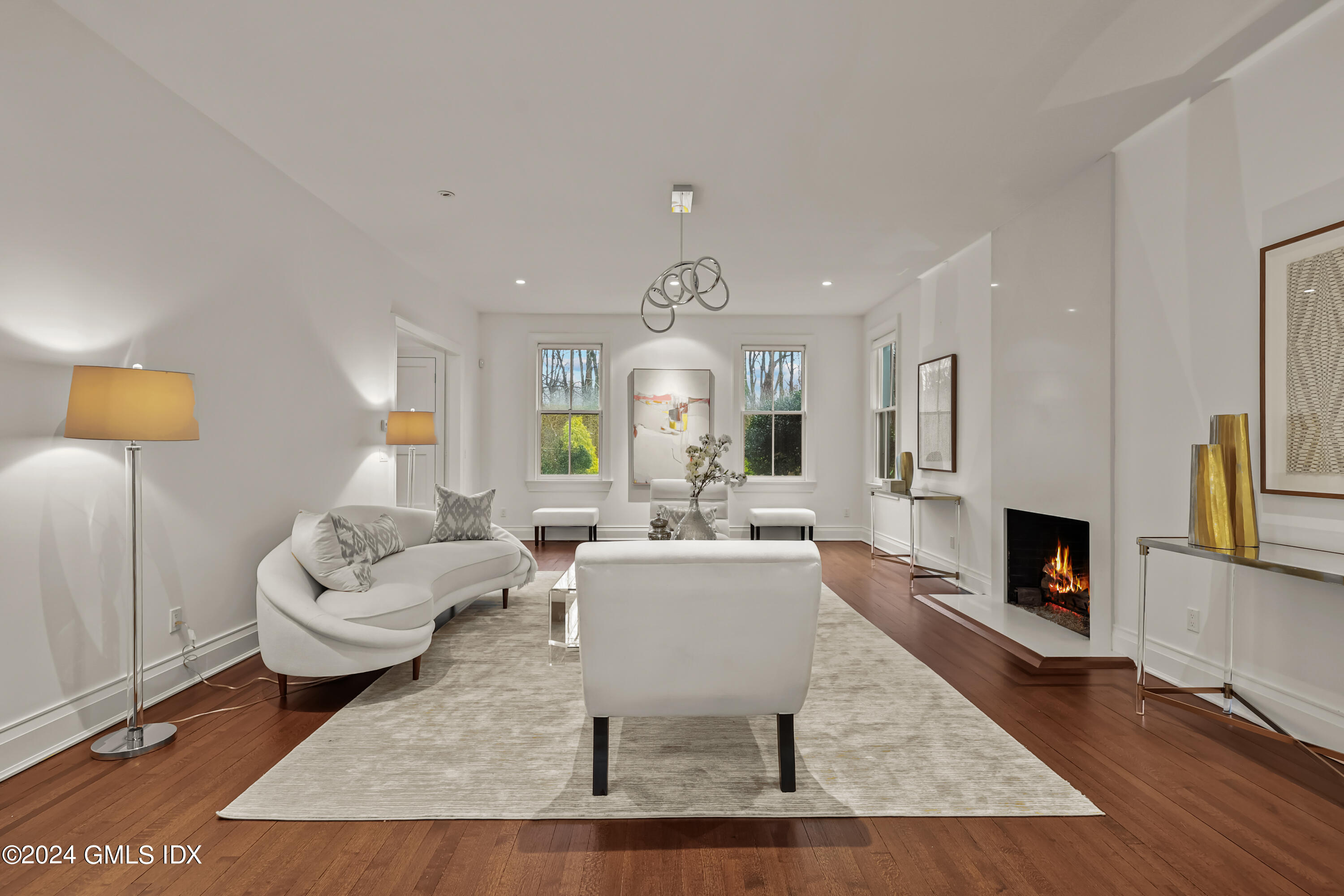 24 Highland Farm Road Greenwich, CT 06831 - Photo 9 of 34 a living room with fireplace furniture and a fireplace