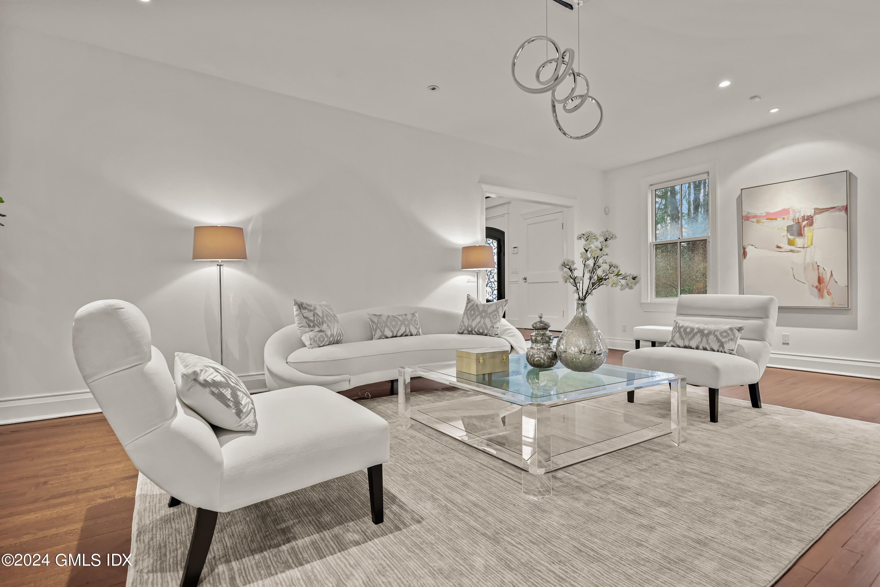 24 Highland Farm Road Greenwich, CT 06831 - Photo 10 of 34 a living room with furniture and a lamp