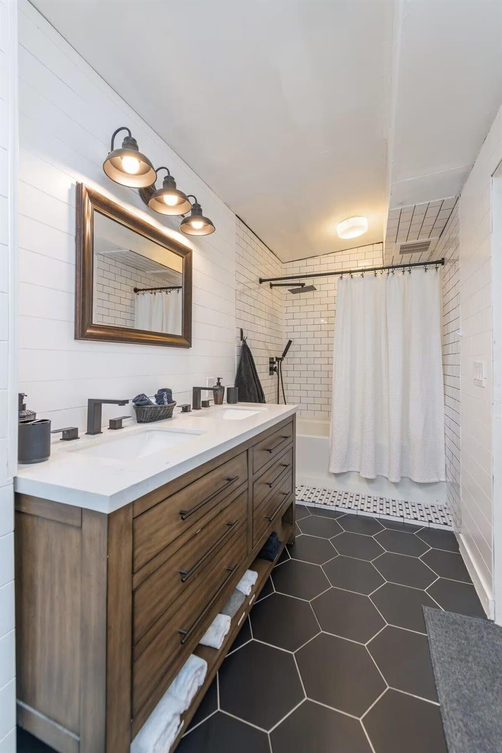 3762 Catalina Road West Palm Beach, FL 33410 - Photo 15 of 29 a bathroom with a sink mirror and a shower