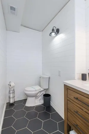 a bathroom with a toilet and a sink