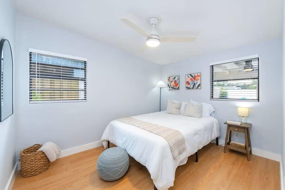 3762 Catalina Road West Palm Beach, FL 33410 - Photo 17 of 29 a bedroom with a bed and wooden floor