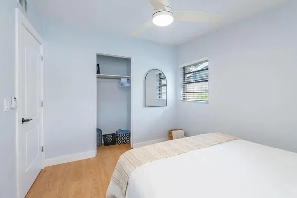a bedroom with a bed and a dresser