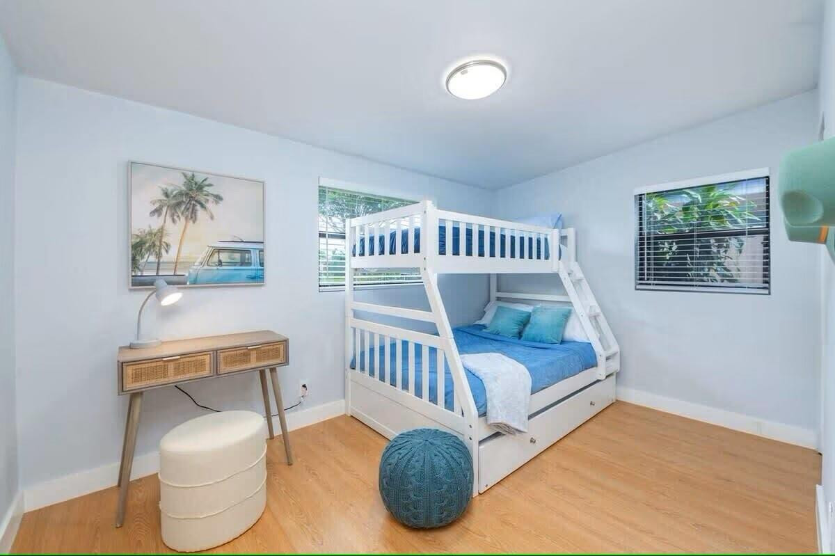 3762 Catalina Road West Palm Beach, FL 33410 - Photo 20 of 29 a bedroom with furniture and a wooden floor