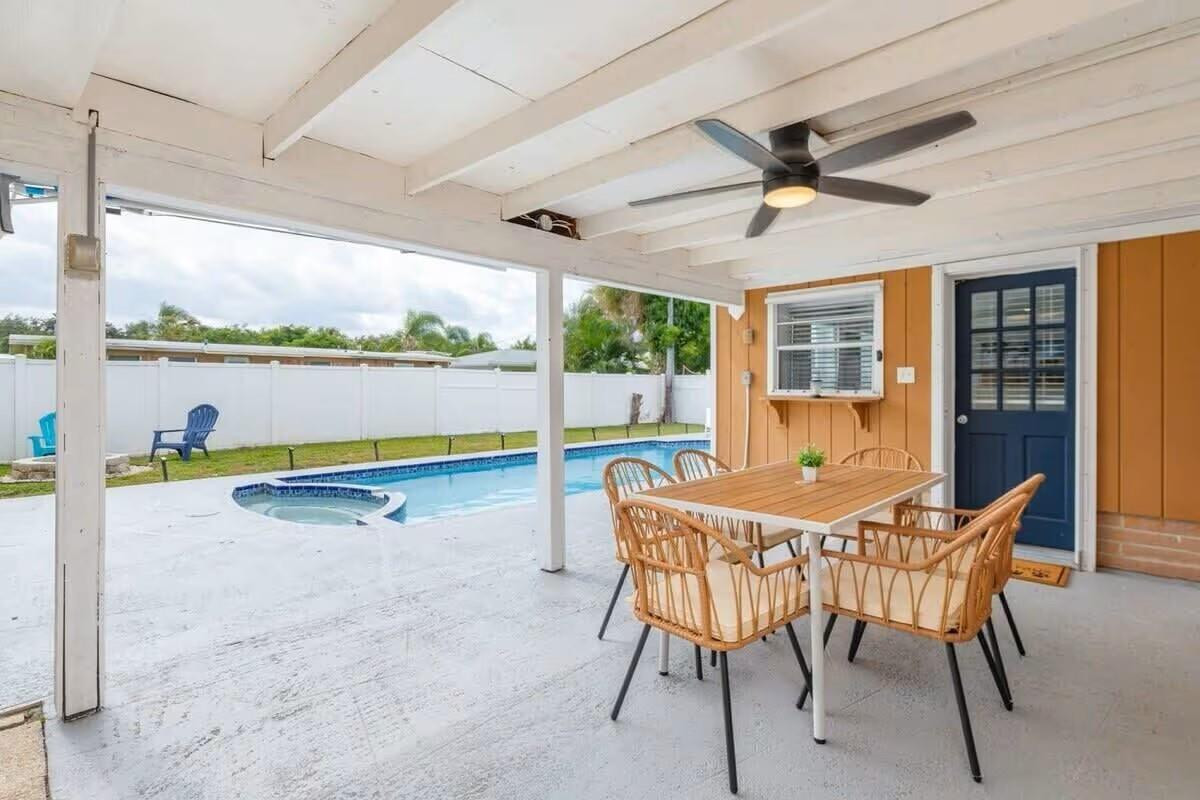 3762 Catalina Road West Palm Beach, FL 33410 - Photo 21 of 29 a dining room with furniture and a floor to ceiling window