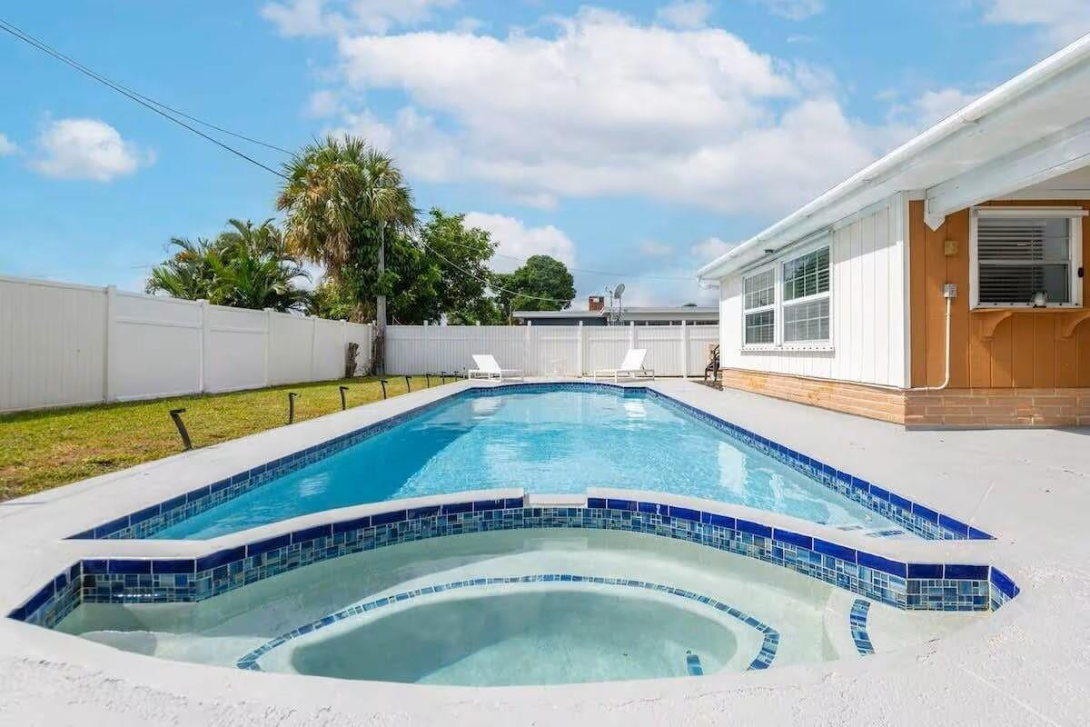 3762 Catalina Road West Palm Beach, FL 33410 - Photo 23 of 29 a view of swimming pool with a back yard