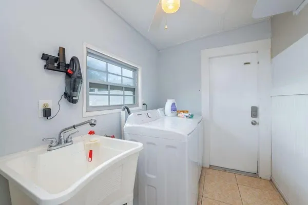 a utility room with dryer and washer