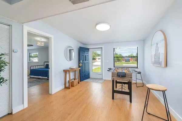 a view of a livingroom with furniture and a kitchen