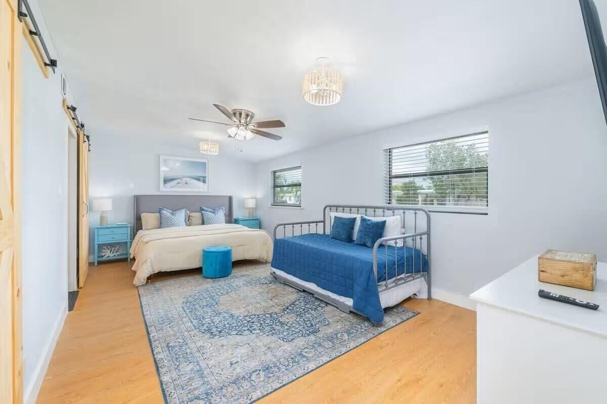 3762 Catalina Road West Palm Beach, FL 33410 - Photo 9 of 29 a bedroom with bed and window