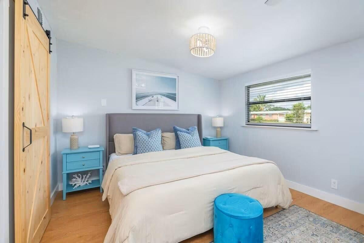 3762 Catalina Road West Palm Beach, FL 33410 - Photo 10 of 29 a bedroom with a bed and a window