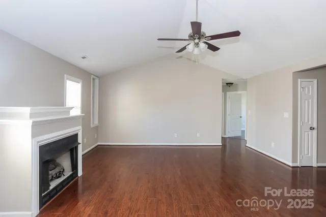 a view of livingroom with hardwood floor and a ceiling fan