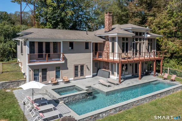 an aerial view of a house with swimming pool