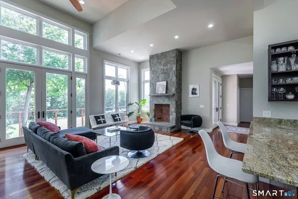 a living room with furniture and a large window