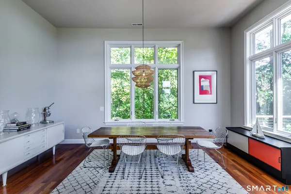 a reading room with furniture lamp and window