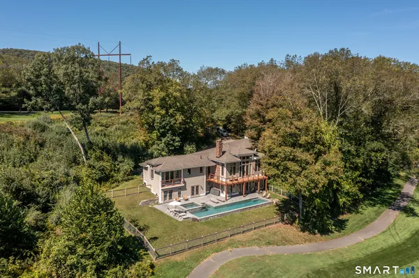 a view of a backyard with sitting area