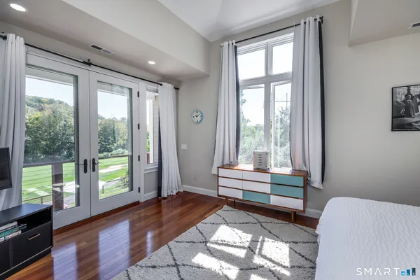 a bathroom with a bathtub and a window