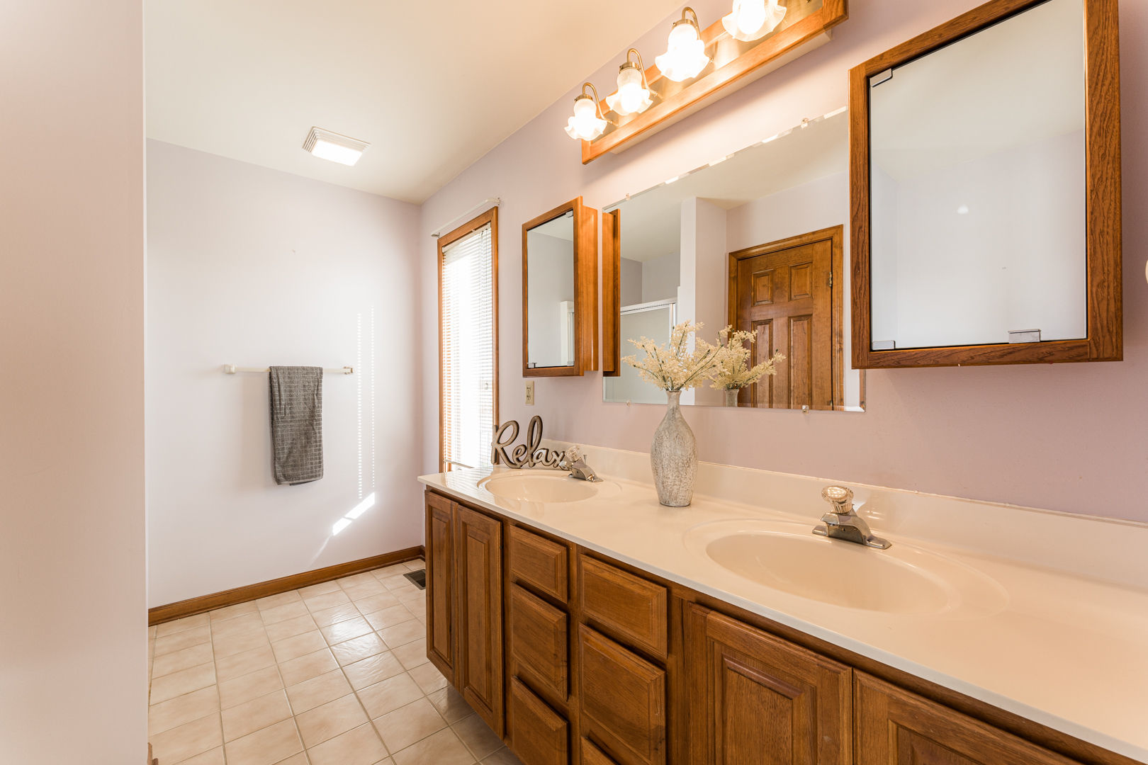 49W170 Lasher Road Big Rock, IL 60511 - Photo 18 of 33 a bathroom with a sink and a mirror