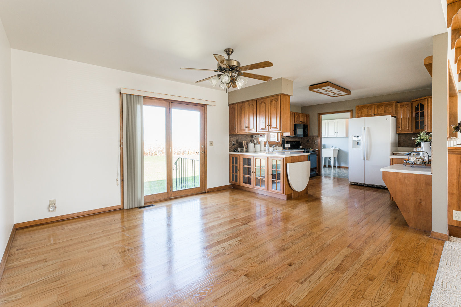 49W170 Lasher Road Big Rock, IL 60511 - Photo 9 of 33 a view of a kitchen with stove and wooden floor