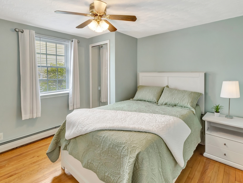 5 G Street Hull, MA 02045 - Photo 26 of 41 a bed sitting in a bedroom next to a window