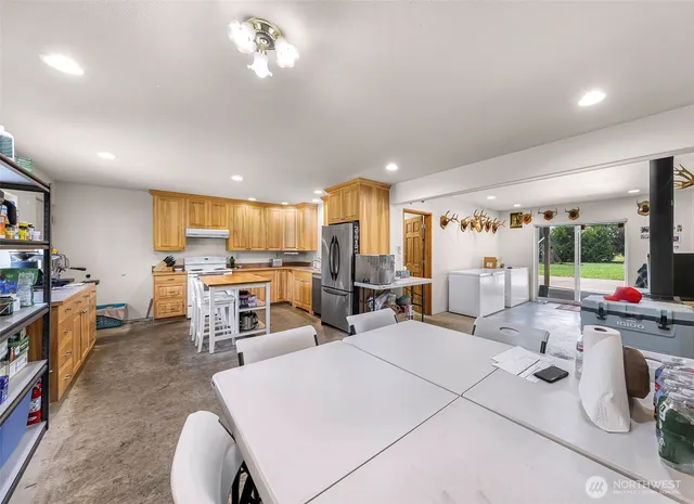 a bathroom with a granite countertop sink a mirror and a shower