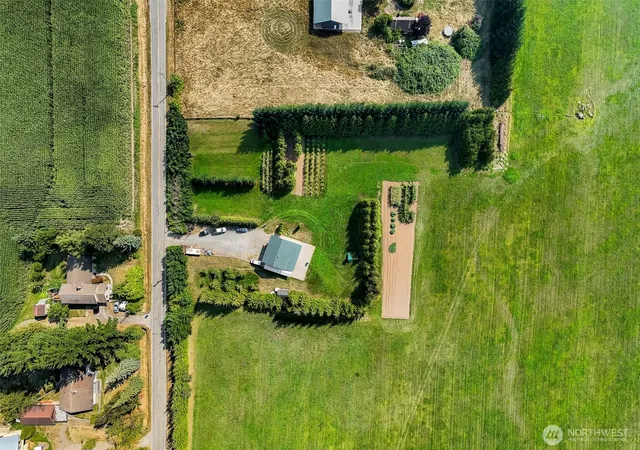 an aerial view of a houses with outdoor space swimming pool and lake view