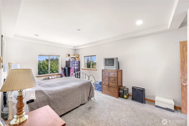 a bedroom with bed and lamp