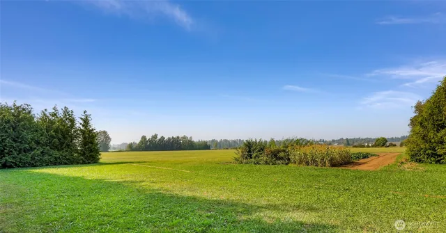 a view of a field with an outdoor space