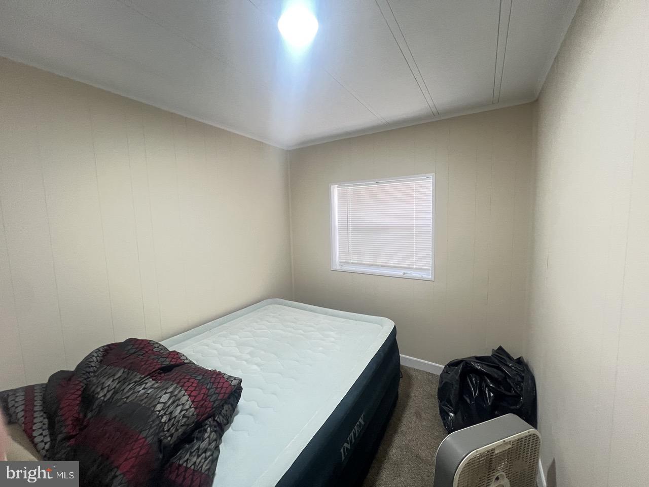 202 Mt Laurel Drive Ridgeley, WV 26753 - Photo 15 of 38 a bedroom with a bed and a window