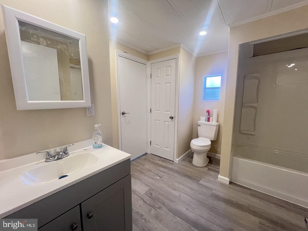 202 Mt Laurel Drive Ridgeley, WV 26753 - Photo 17 of 38 a bathroom with a sink mirror toilet and shower
