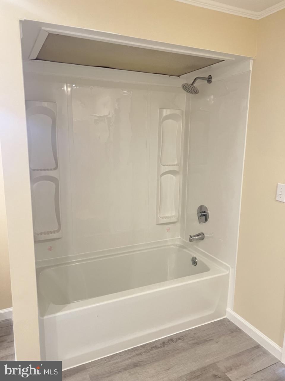 202 Mt Laurel Drive Ridgeley, WV 26753 - Photo 19 of 38 a bathroom with a bathtub and a shower