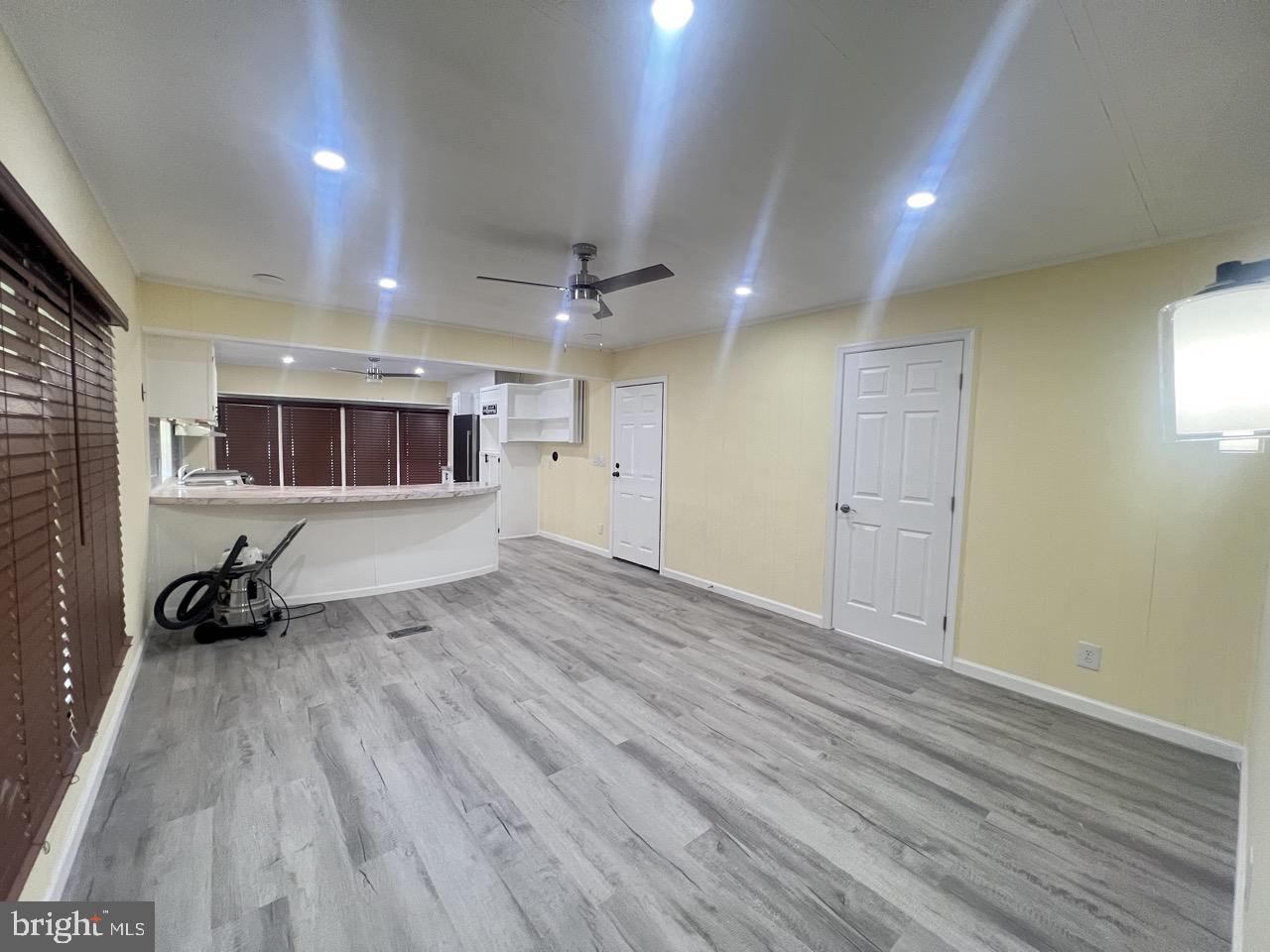202 Mt Laurel Drive Ridgeley, WV 26753 - Photo 10 of 38 an empty room with wooden floor and windows