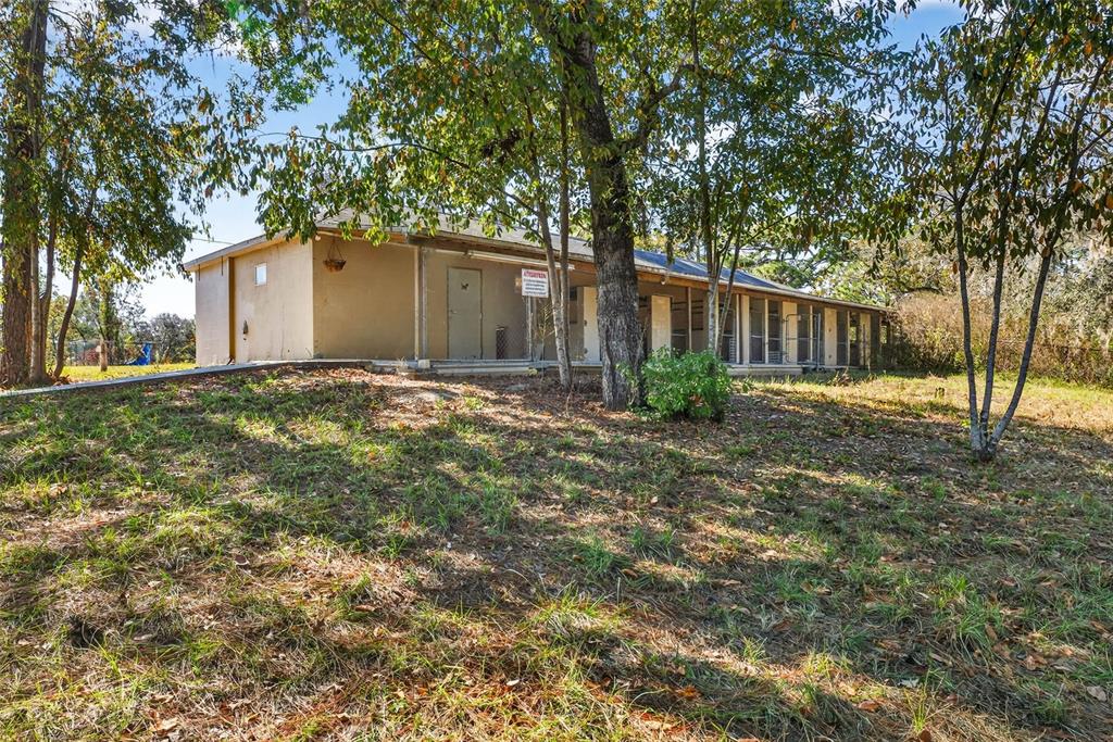 14252 Trinity Road Brooksville, FL 34614 - Photo 19 of 26 a view of backyard of house with green space