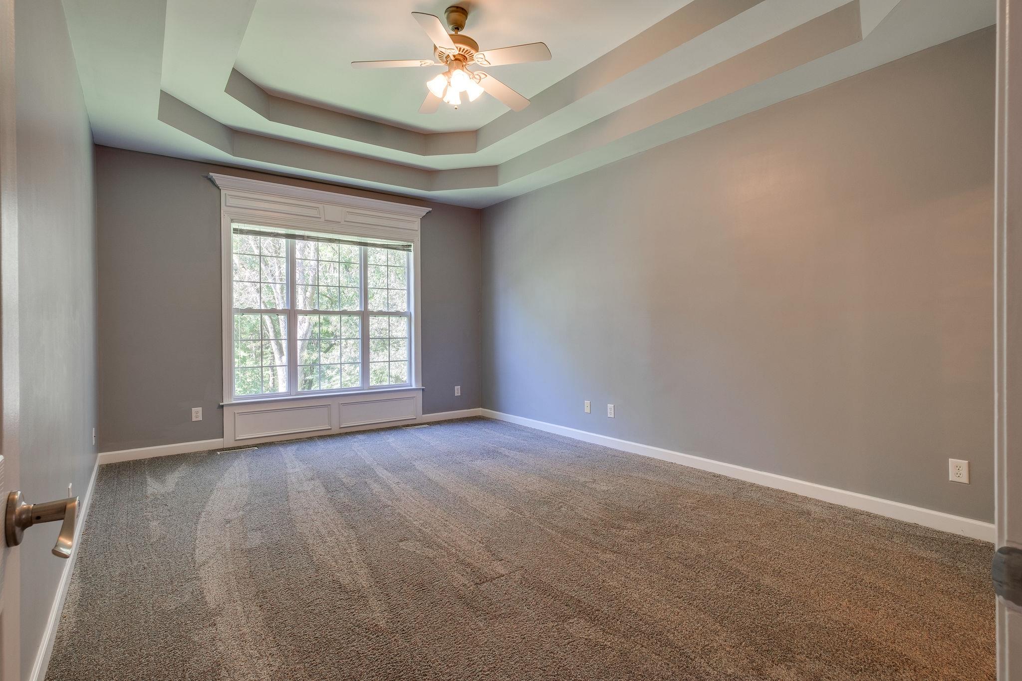 2005 Viewpointe Way Columbia, TN 38401 - Photo 14 of 29 an empty room with a chandelier fan and windows