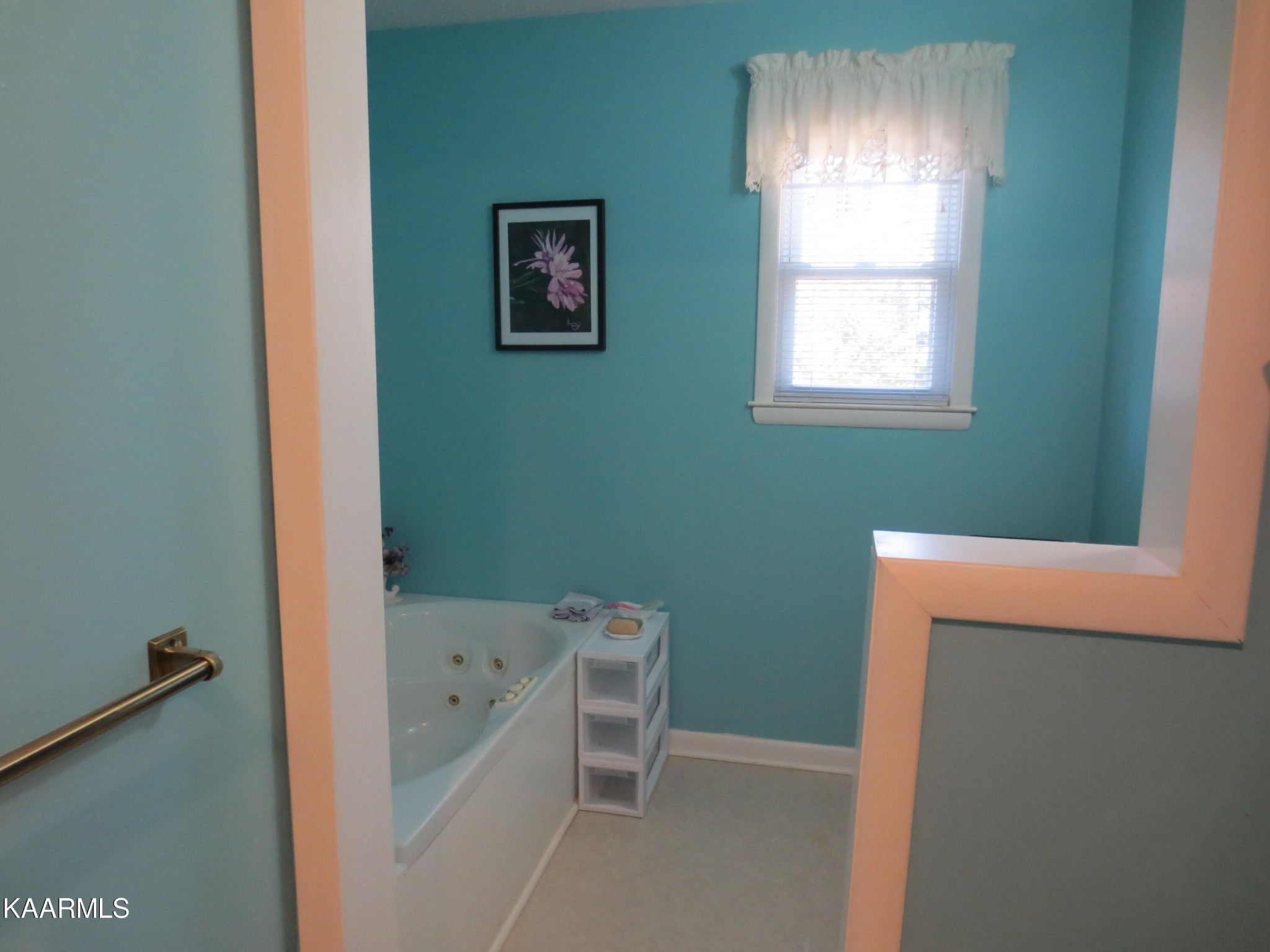 1327 Ridgeway Circle Athens, TN 37303 - Photo 16 of 49 a bathroom with a bathtub and a window