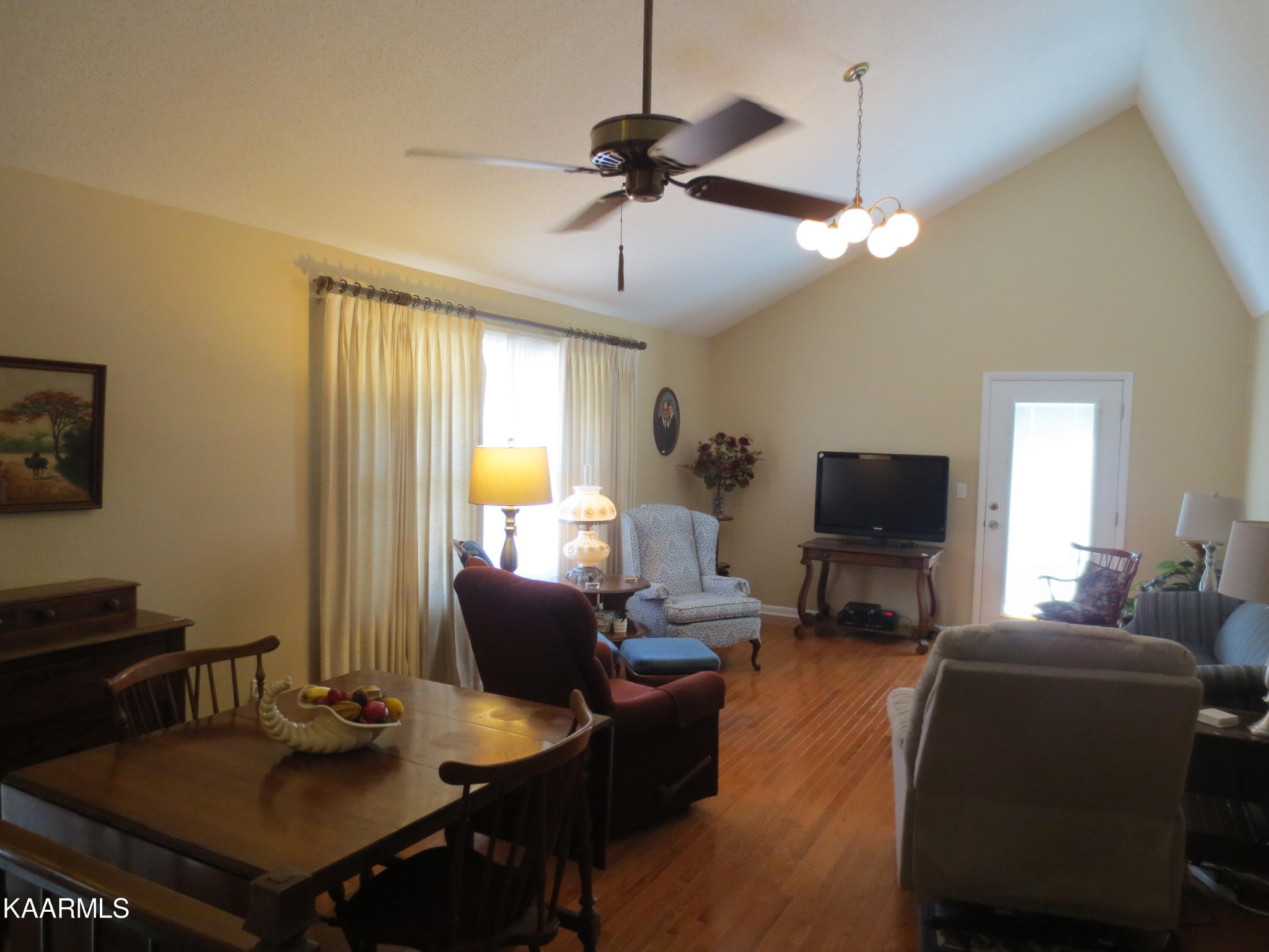 1327 Ridgeway Circle Athens, TN 37303 - Photo 3 of 49 a living room with furniture a chandelier and a flat screen tv