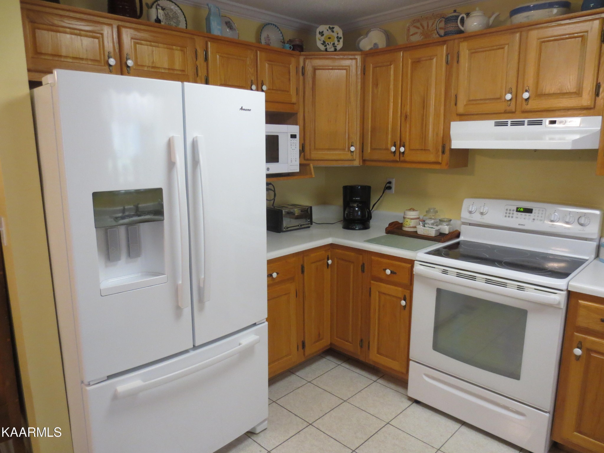 1327 Ridgeway Circle Athens, TN 37303 - Photo 10 of 49 a white refrigerator freezer sitting in a kitchen