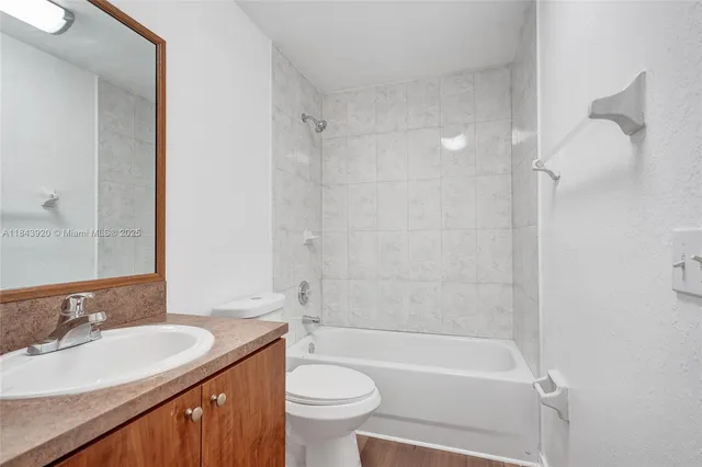 a view of walk in closet with wooden floor