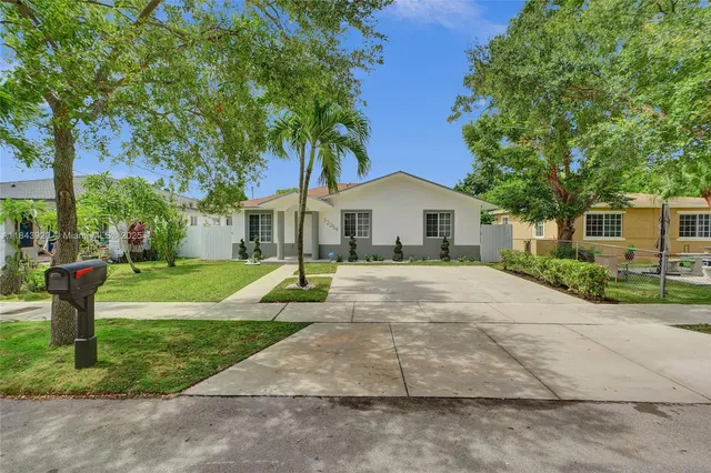 front view of a house with a garden