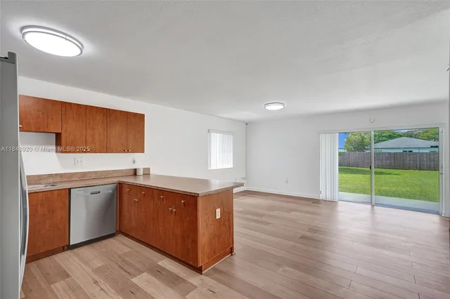 a kitchen with sink and cabinets