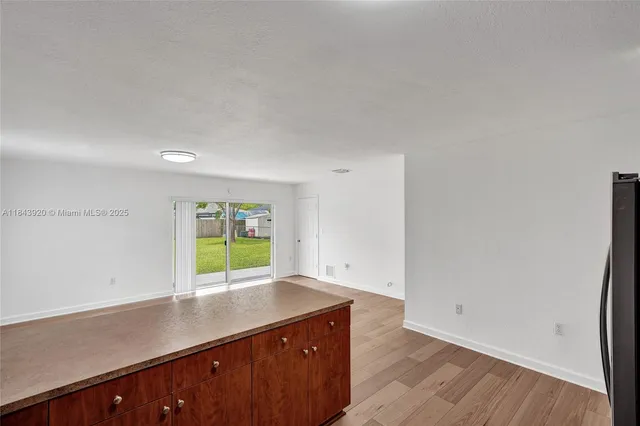 a view of kitchen with wooden floor