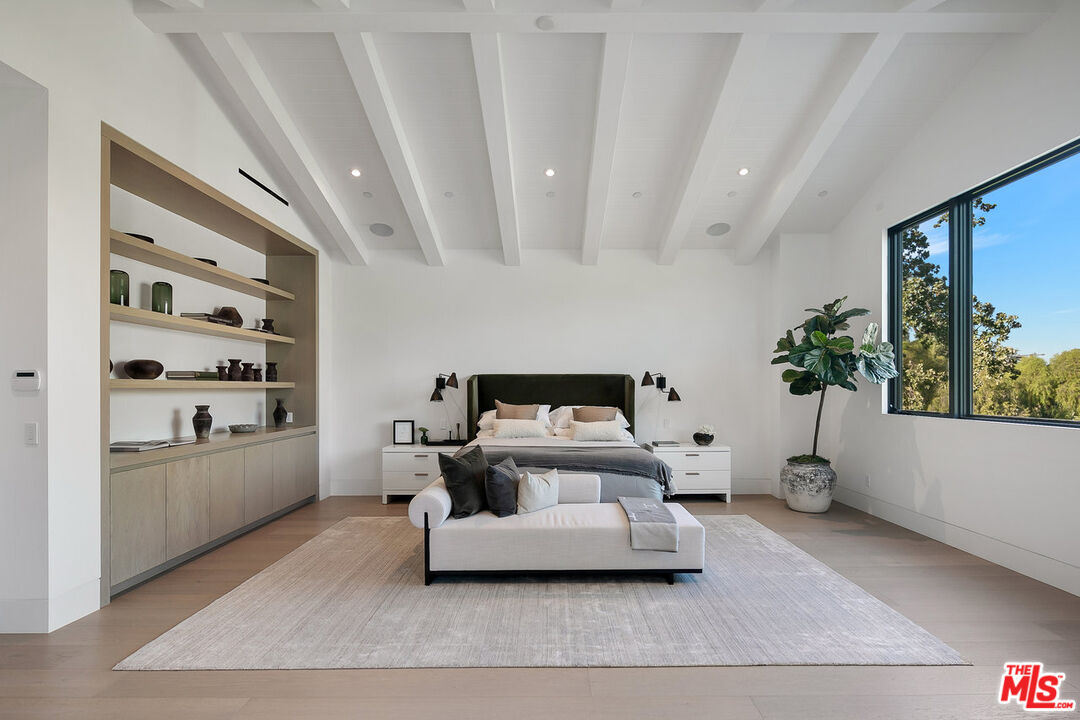 5376 Round Meadow Road Hidden Hills, CA 91302 - Photo 13 of 31 a living room with furniture and a potted plant