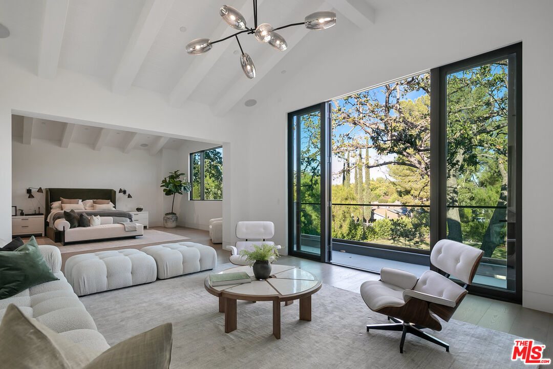5376 Round Meadow Road Hidden Hills, CA 91302 - Photo 14 of 31 a living room with furniture and a large window