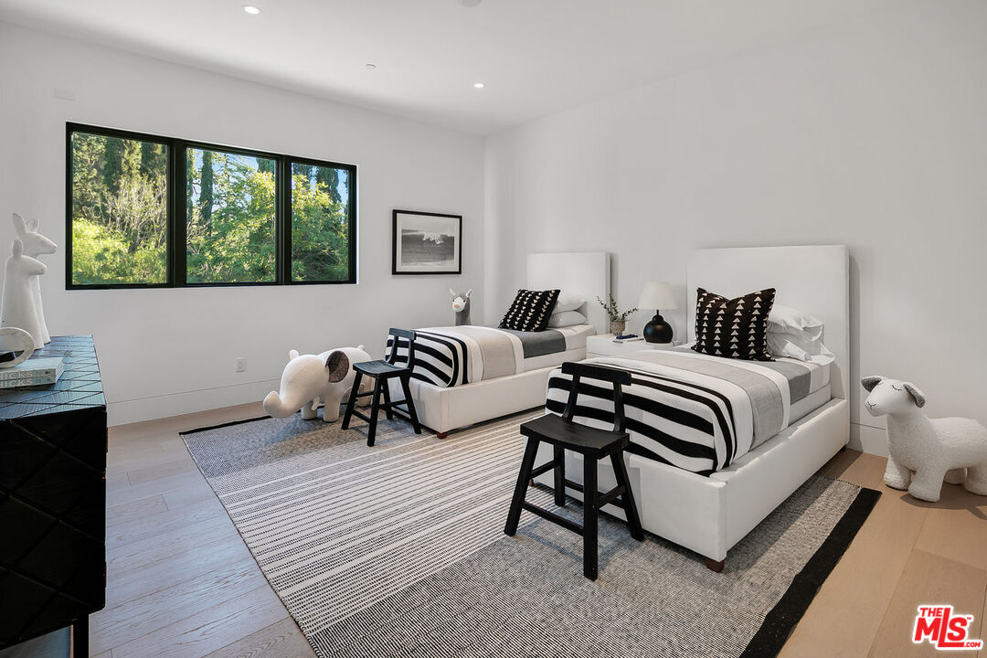 5376 Round Meadow Road Hidden Hills, CA 91302 - Photo 20 of 31 a bedroom with a bed and a window