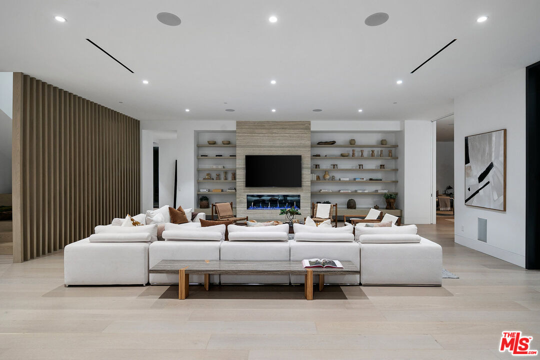 5376 Round Meadow Road Hidden Hills, CA 91302 - Photo 25 of 31 a bedroom with furniture and a flat screen tv