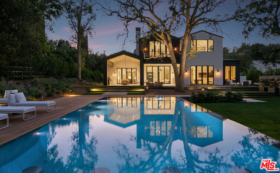 5376 Round Meadow Road Hidden Hills, CA 91302 - Photo 31 of 31 a view of a house with pool and lake view