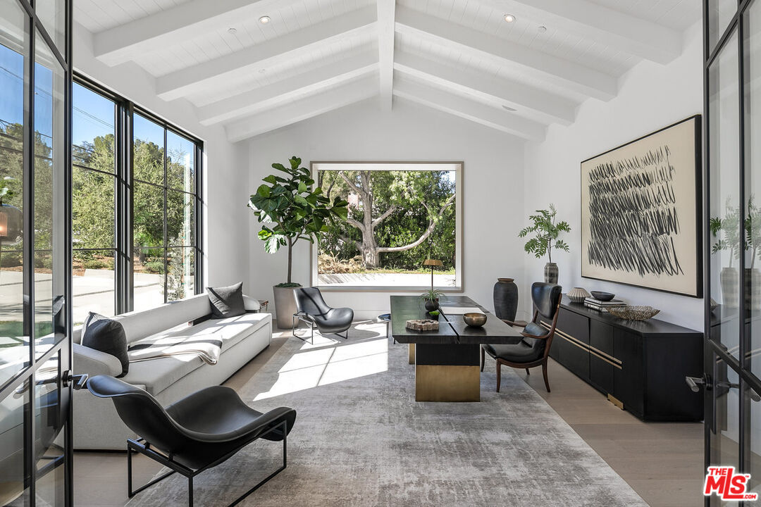 5376 Round Meadow Road Hidden Hills, CA 91302 - Photo 4 of 31 a living room with furniture and a large window